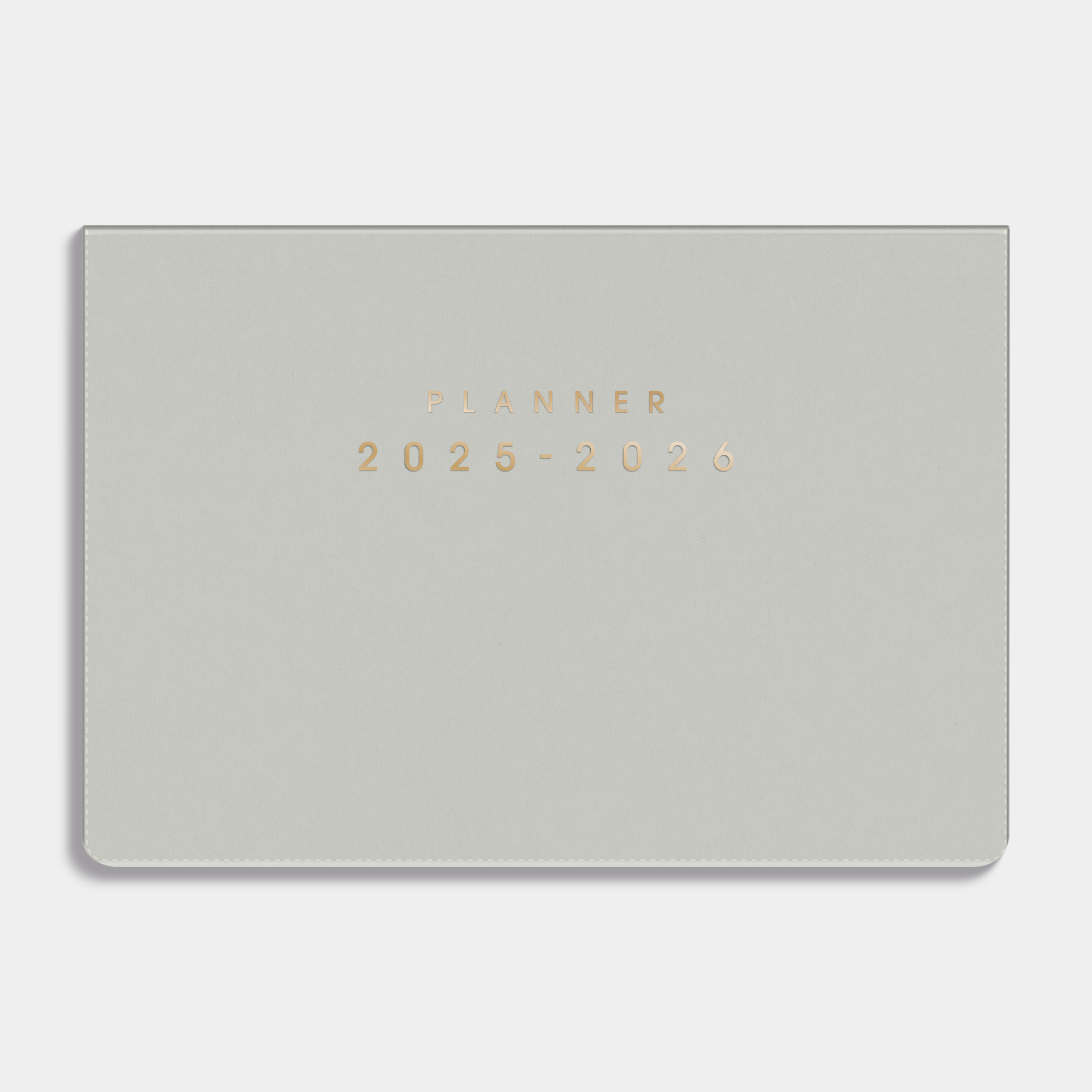 Maandplanner 2025 - 2026 A5 met een flexibele lichtgrijze coverhoes – vooraanzicht.