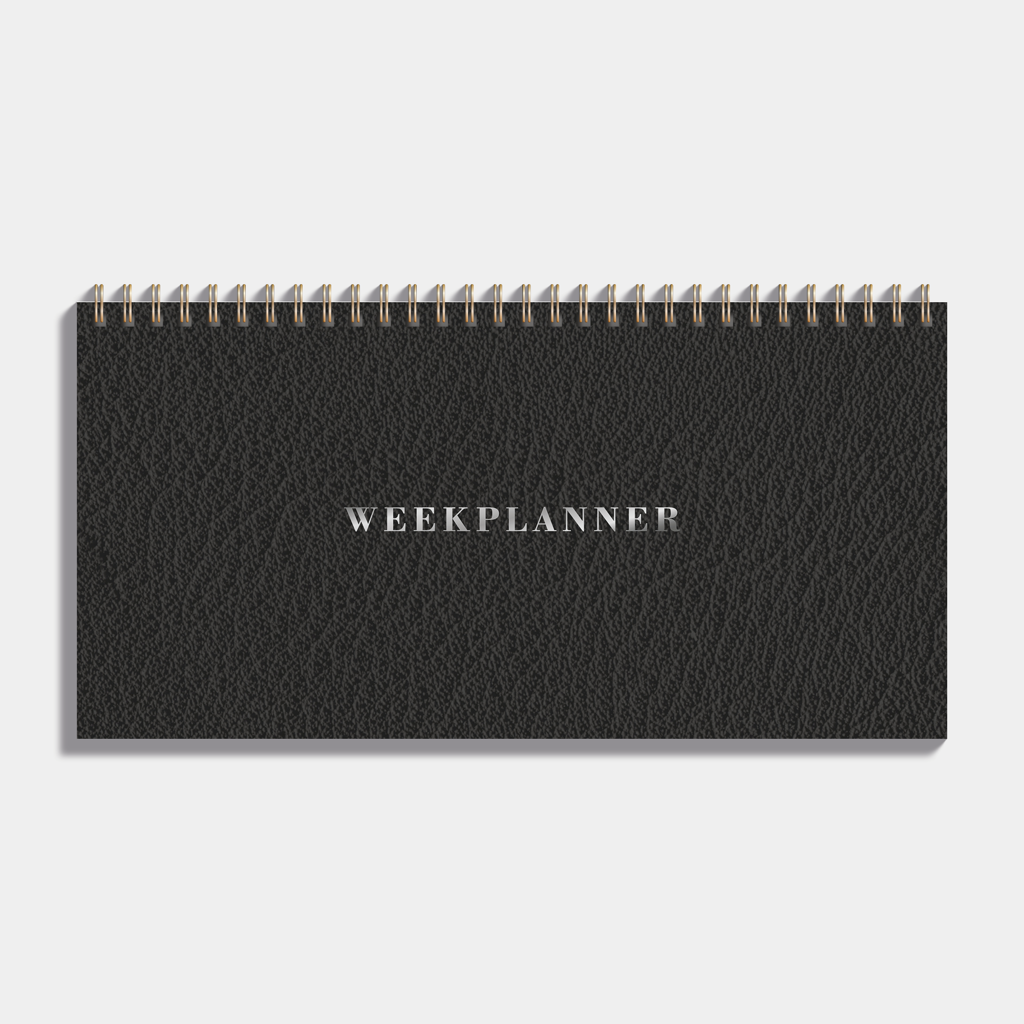 Bureauplanner undated met zwarte lederlook cover en metalen ringband – vooraanzicht.