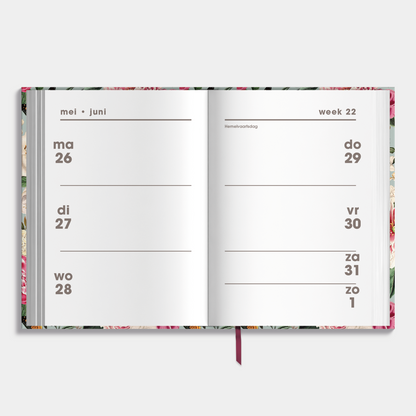 Mini agenda 2025-2026 met brocante bloemenprint en harde cover – binnenwerk met weekoverzicht.