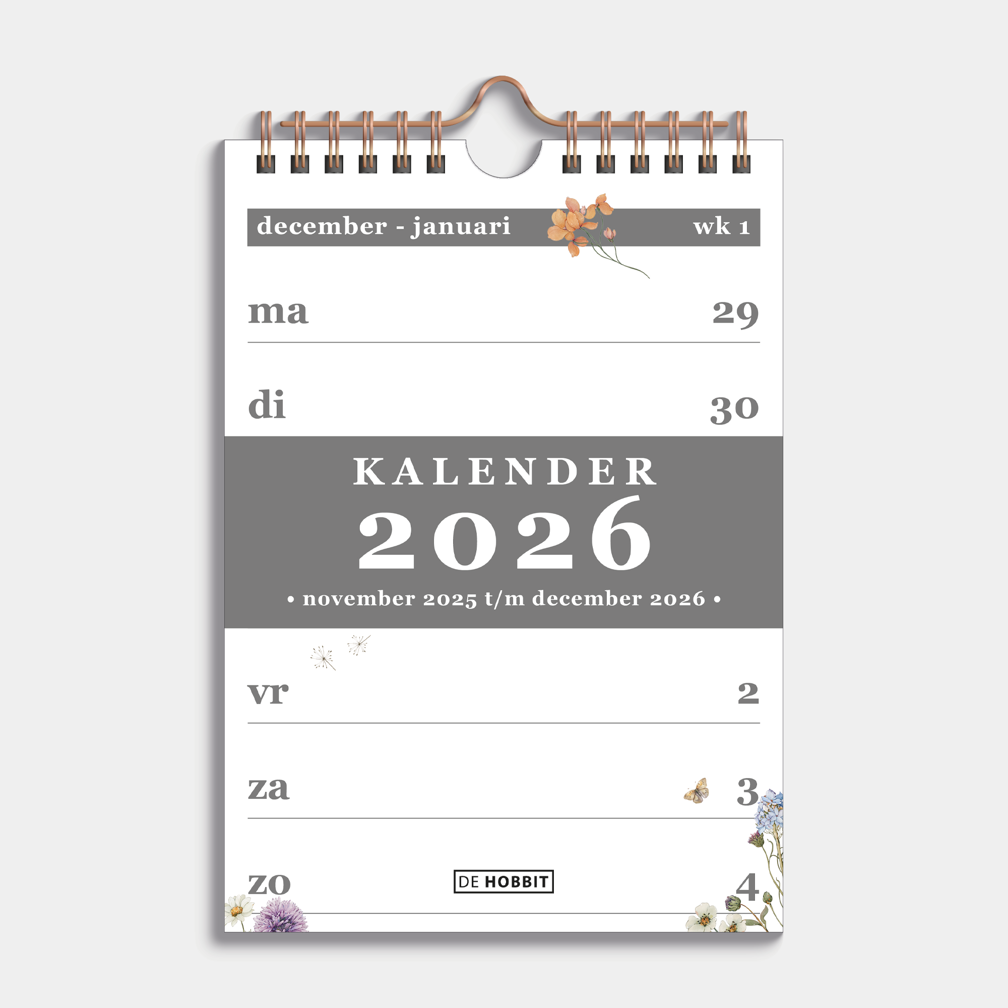 Weekkalender 2026 in A5 formaat met een subtiele print van weidebloemen, gebonden in een koperkleurige metalen spiraal en hanger – vooraanzicht met voorblad.